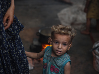 Displaced Palestinian children are staying at a camp for displaced Palestinians in Deir al-Balah, in the central Gaza Strip, on June 26, 202...