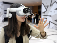 Visitors are experiencing a large-scale Space Exploration VR immersive exhibition in Suzhou, China, on June 26, 2024. (