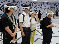 Visitors are experiencing a large-scale Space Exploration VR immersive exhibition in Suzhou, China, on June 26, 2024. (