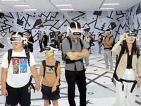 Visitors are experiencing a large-scale Space Exploration VR immersive exhibition in Suzhou, China, on June 26, 2024. (