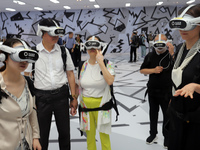 Visitors are experiencing a large-scale Space Exploration VR immersive exhibition in Suzhou, China, on June 26, 2024. (