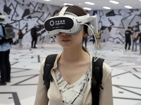 Visitors are experiencing a large-scale Space Exploration VR immersive exhibition in Suzhou, China, on June 26, 2024. (