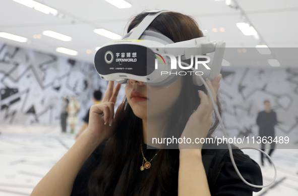 Visitors are experiencing a large-scale Space Exploration VR immersive exhibition in Suzhou, China, on June 26, 2024. 