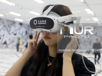 Visitors are experiencing a large-scale Space Exploration VR immersive exhibition in Suzhou, China, on June 26, 2024. (