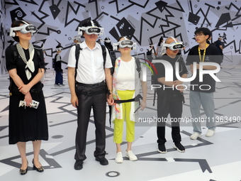 Visitors are experiencing a large-scale Space Exploration VR immersive exhibition in Suzhou, China, on June 26, 2024. (