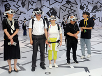 Visitors are experiencing a large-scale Space Exploration VR immersive exhibition in Suzhou, China, on June 26, 2024. (