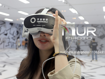 Visitors are experiencing a large-scale Space Exploration VR immersive exhibition in Suzhou, China, on June 26, 2024. (