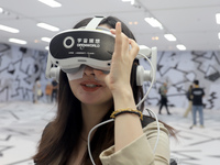 Visitors are experiencing a large-scale Space Exploration VR immersive exhibition in Suzhou, China, on June 26, 2024. (