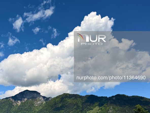 Storm clouds are beginning to form on the horizon, announcing the imminent arrival of a storm in Zurich, Switzerland, on June 27, 2024. 