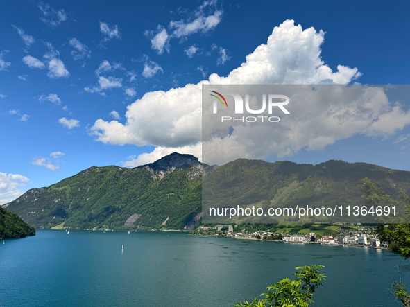 Storm clouds are beginning to form on the horizon, announcing the imminent arrival of a storm in the Lucerne lake, in Zurich, Switzerland, o...