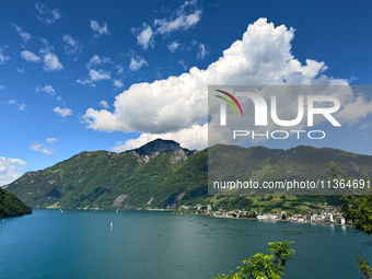 Storm clouds are beginning to form on the horizon, announcing the imminent arrival of a storm in the Lucerne lake, in Zurich, Switzerland, o...