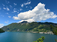 Storm clouds are beginning to form on the horizon, announcing the imminent arrival of a storm in the Lucerne lake, in Zurich, Switzerland, o...