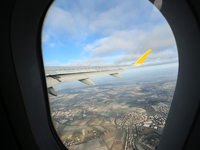 Clouds are appearing on the horizon, viewed from the window of an Airbus A321 from Vueling Airlines in Zurich, Switzerland, on June 27, 2024...