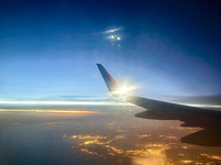 Clouds are appearing on the horizon, viewed from the window of an Airbus A321 from Vueling Airlines in Zurich, Switzerland, on June 27, 2024...