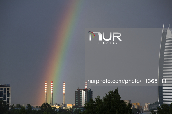 A rainbow is appearing over the eastern part of Sofia, Bulgaria, on June 27, 2024. 