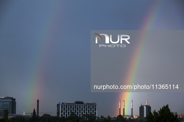 A rainbow is appearing over the eastern part of Sofia, Bulgaria, on June 27, 2024. 