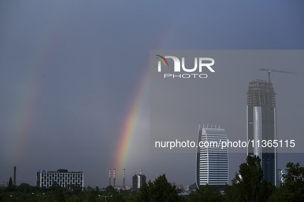 A rainbow is appearing over the eastern part of Sofia, Bulgaria, on June 27, 2024. 