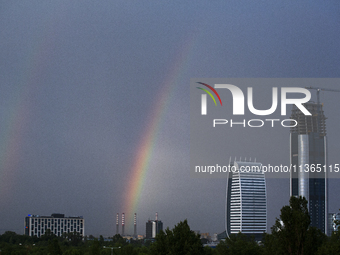 A rainbow is appearing over the eastern part of Sofia, Bulgaria, on June 27, 2024. (