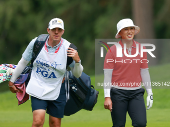 Amy Yang of Republic of Korea walks with her caddie to the 18th green during the final round of the KPMG Women's PGA Championship at Sahalee...