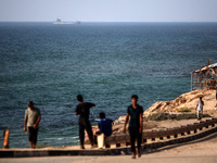 A ship is being pictured off the coast of Gaza near a temporary floating pier anchored by the United States to boost aid deliveries, as seen...