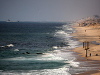 A ship is being pictured off the coast of Gaza near a temporary floating pier anchored by the United States to boost aid deliveries, as seen...