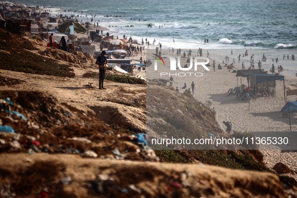 Palestinians are gathering on the beach in Nuseirat in the central Gaza Strip on June 27, 2024, amid ongoing cross-border tensions as fighti...