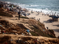 Palestinians are gathering on the beach in Nuseirat in the central Gaza Strip on June 27, 2024, amid ongoing cross-border tensions as fighti...