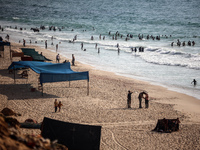 Palestinians are gathering on the beach in Nuseirat in the central Gaza Strip on June 27, 2024, amid ongoing cross-border tensions as fighti...