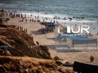 Palestinians are gathering on the beach in Nuseirat in the central Gaza Strip on June 27, 2024, amid ongoing cross-border tensions as fighti...