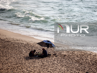 Palestinians are gathering on the beach in Nuseirat in the central Gaza Strip on June 27, 2024, amid ongoing cross-border tensions as fighti...