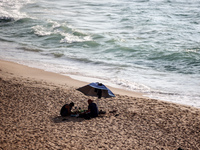 Palestinians are gathering on the beach in Nuseirat in the central Gaza Strip on June 27, 2024, amid ongoing cross-border tensions as fighti...