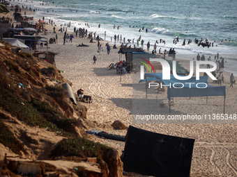 Palestinians are gathering on the beach in Nuseirat in the central Gaza Strip on June 27, 2024, amid ongoing cross-border tensions as fighti...