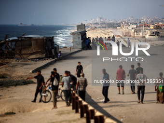 A ship is being pictured off the coast of Gaza near a temporary floating pier anchored by the United States to boost aid deliveries, as seen...