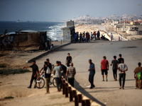 A ship is being pictured off the coast of Gaza near a temporary floating pier anchored by the United States to boost aid deliveries, as seen...