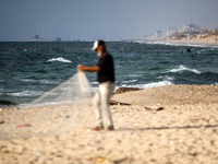 A ship is being pictured off the coast of Gaza near a temporary floating pier anchored by the United States to boost aid deliveries, as seen...