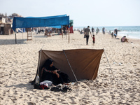 Palestinians are gathering on the beach in Nuseirat in the central Gaza Strip on June 27, 2024, amid ongoing cross-border tensions as fighti...