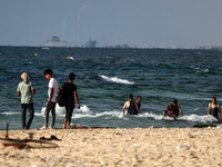 A ship is being pictured off the coast of Gaza near a temporary floating pier anchored by the United States to boost aid deliveries, as seen...