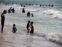 Palestinians are gathering on the beach in Nuseirat in the central Gaza Strip on June 27, 2024, amid ongoing cross-border tensions as fighti...