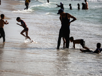 Palestinians are gathering on the beach in Nuseirat in the central Gaza Strip on June 27, 2024, amid ongoing cross-border tensions as fighti...