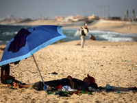 Palestinians are gathering on the beach in Nuseirat in the central Gaza Strip on June 27, 2024, amid ongoing cross-border tensions as fighti...