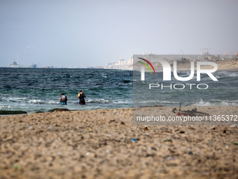 A ship is being pictured off the coast of Gaza near a temporary floating pier anchored by the United States to boost aid deliveries, as seen...