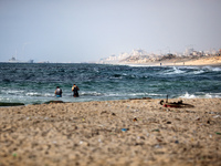 A ship is being pictured off the coast of Gaza near a temporary floating pier anchored by the United States to boost aid deliveries, as seen...