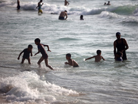 Palestinians are gathering on the beach in Nuseirat in the central Gaza Strip on June 27, 2024, amid ongoing cross-border tensions as fighti...