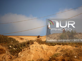 Palestinians are gathering on the beach in Nuseirat in the central Gaza Strip on June 27, 2024, amid ongoing cross-border tensions as fighti...