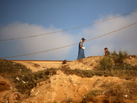 Palestinians are gathering on the beach in Nuseirat in the central Gaza Strip on June 27, 2024, amid ongoing cross-border tensions as fighti...