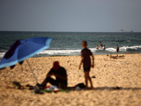 A ship is being pictured off the coast of Gaza near a temporary floating pier anchored by the United States to boost aid deliveries, as seen...