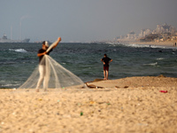 A ship is being pictured off the coast of Gaza near a temporary floating pier anchored by the United States to boost aid deliveries, as seen...