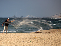 A ship is being pictured off the coast of Gaza near a temporary floating pier anchored by the United States to boost aid deliveries, as seen...