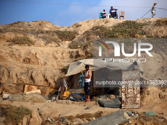 Palestinians are gathering on the beach in Nuseirat in the central Gaza Strip on June 27, 2024, amid ongoing cross-border tensions as fighti...