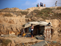 Palestinians are gathering on the beach in Nuseirat in the central Gaza Strip on June 27, 2024, amid ongoing cross-border tensions as fighti...